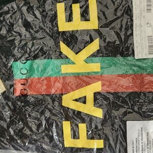 NwT $260 Gucci Black Tee with Yellow 'FAKE' and Stripes